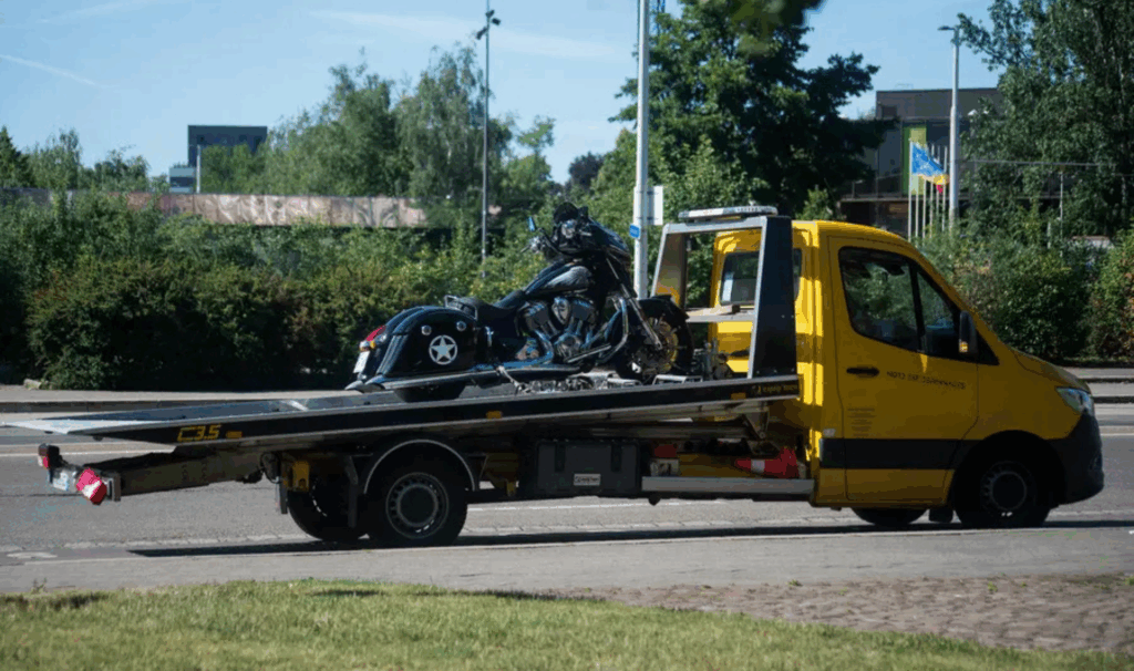 Polina Transporter LLC tow truck driving on New Jersey highway