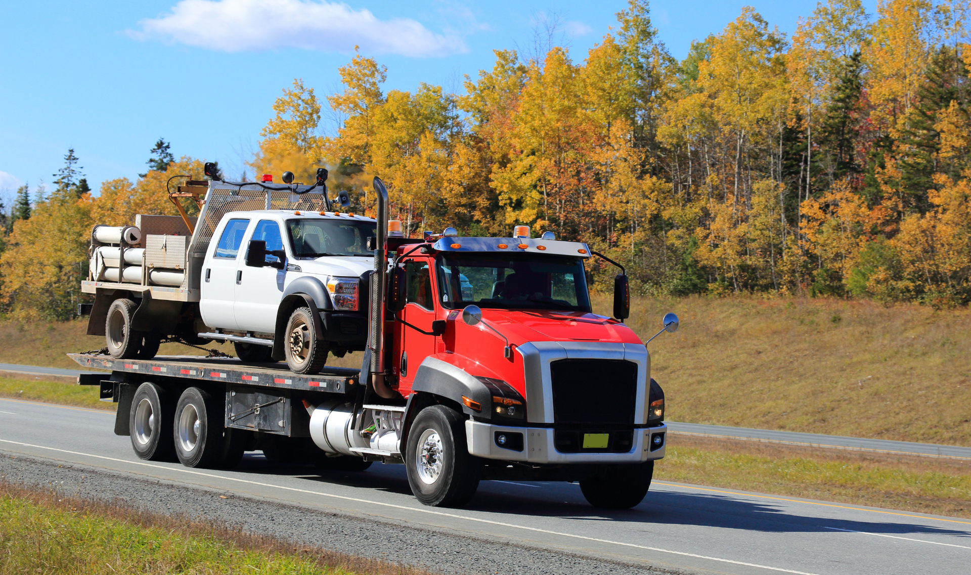 24 hour tow truck service assisting a broken-down vehicle on a New Jersey highway at night